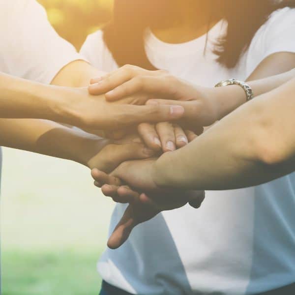 Group of people holding hands